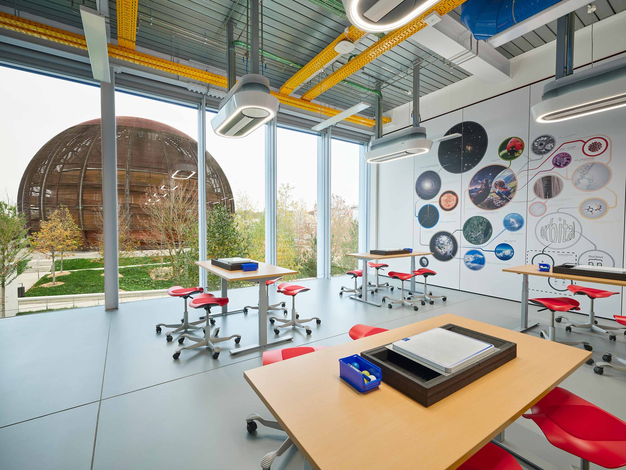 Red HÅG Capisco Puls Stools in children's workshop lab at European Laboratory for Particle Physics (CERN) | Photo : Sarah Reuland