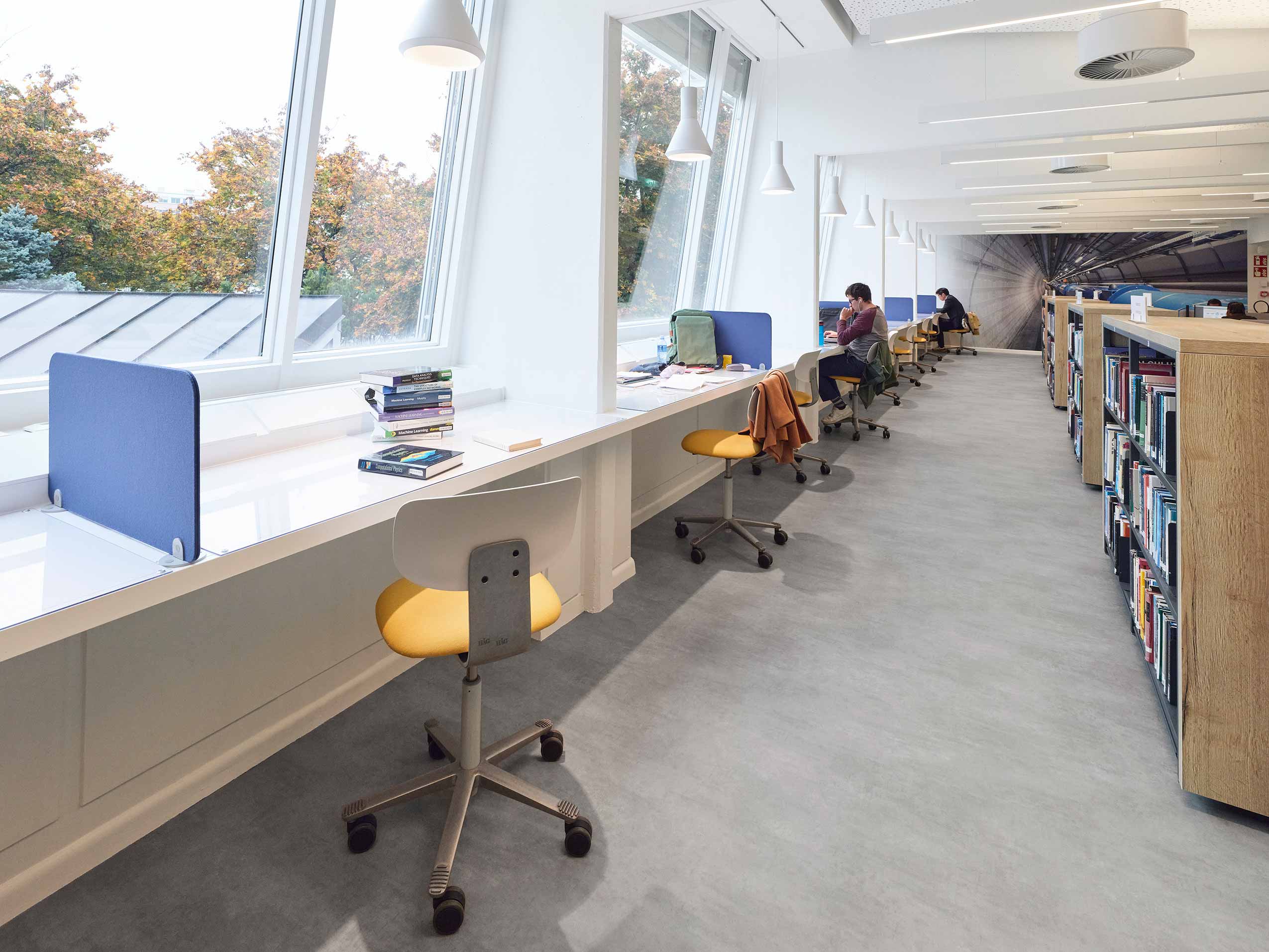 Yellow and white HÅG Tion chairs at window bench in Library space at European Laboratory for Particle Physics (CERN) | Photo : Sarah Reuland