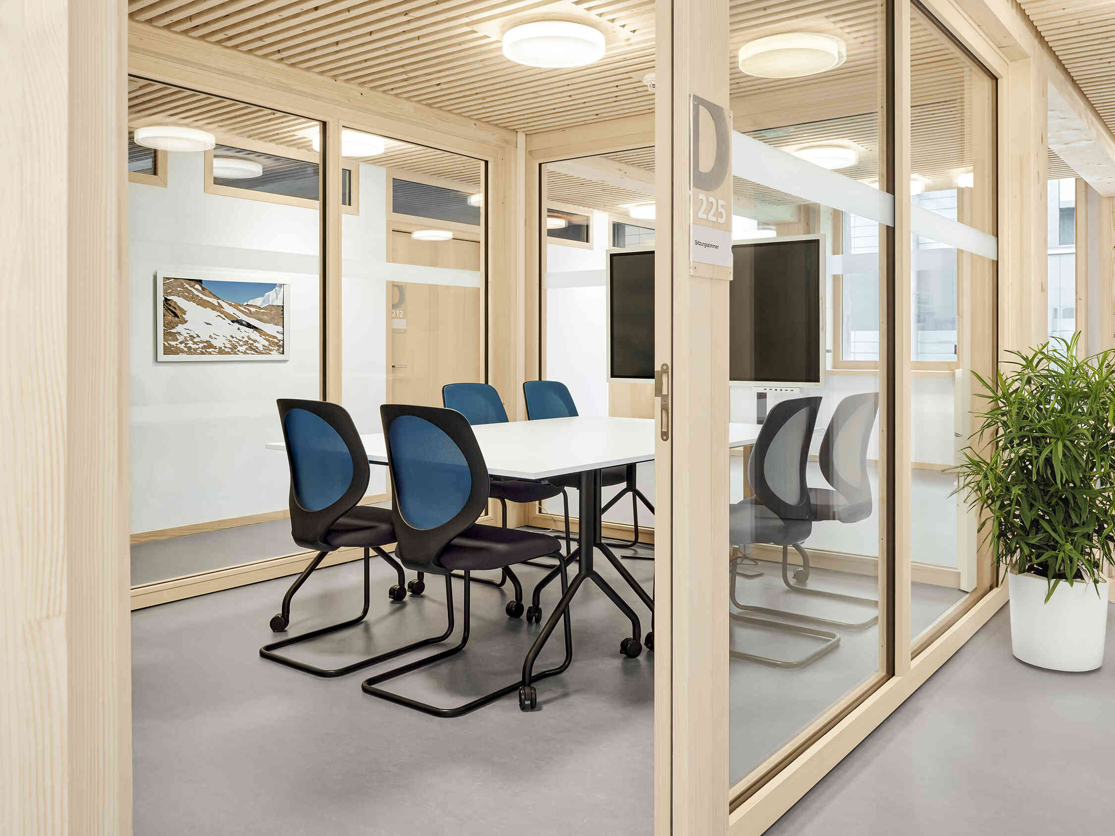 another view of office meeting room at WSL Davos, with Giroflex 353 chairs around a table