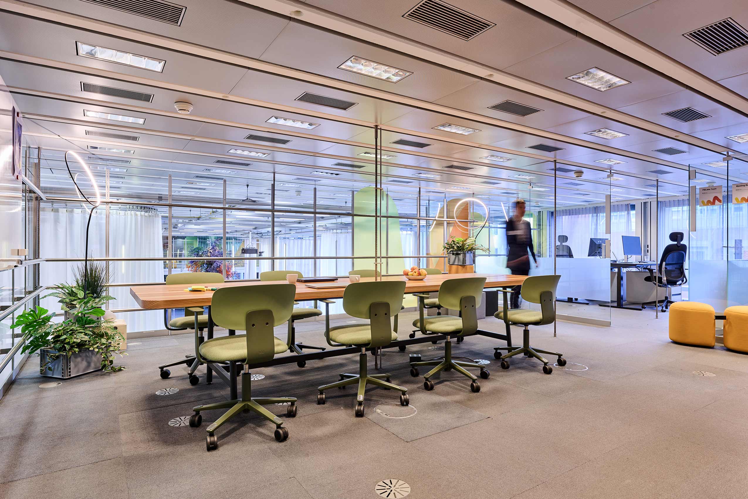 interior of meeting room at ETH zurich, with green HÅG Celi chairs around a table