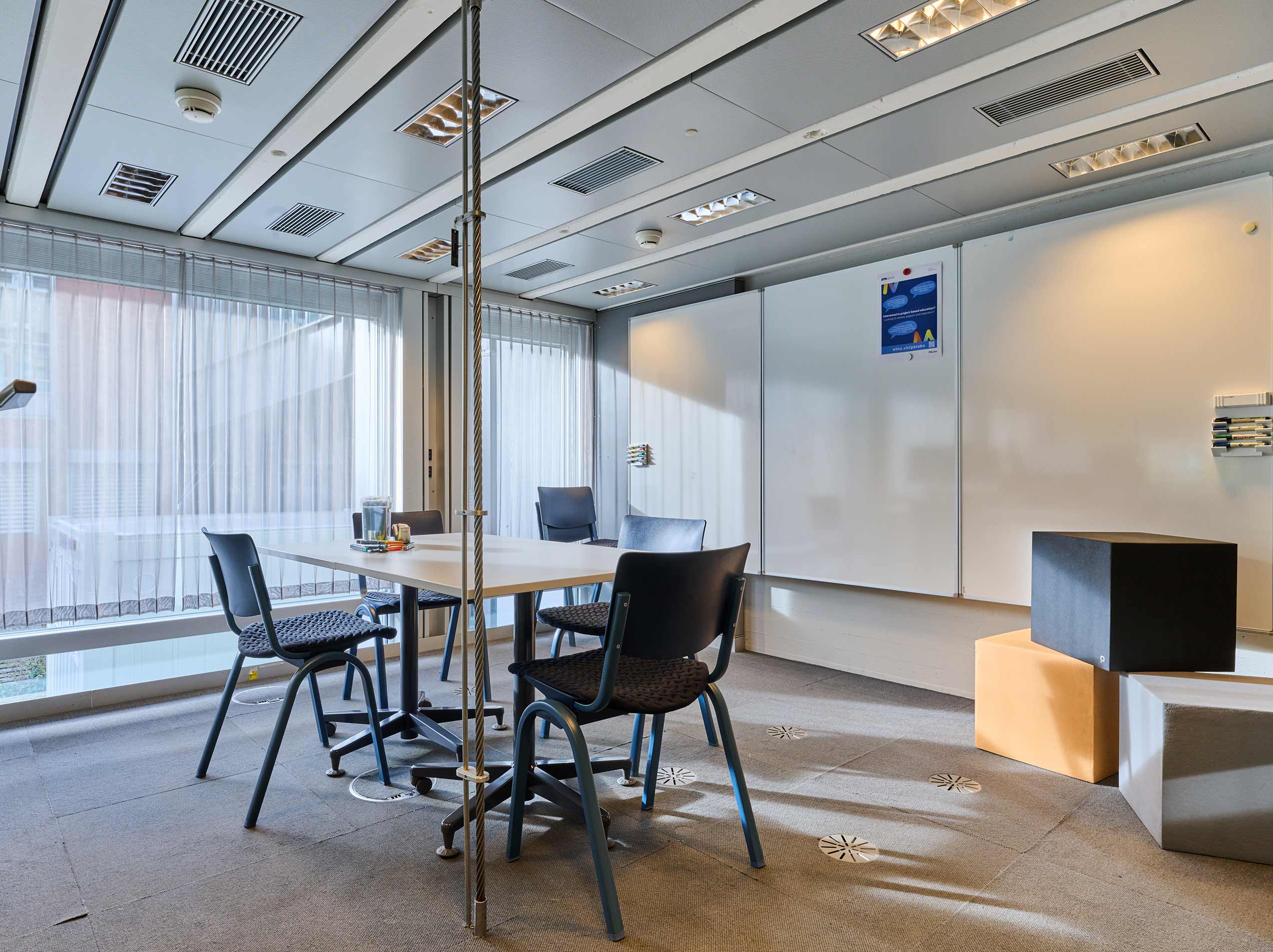 4 HÅG Celi chairs around a small table in an office meeting room at ETH Zurich