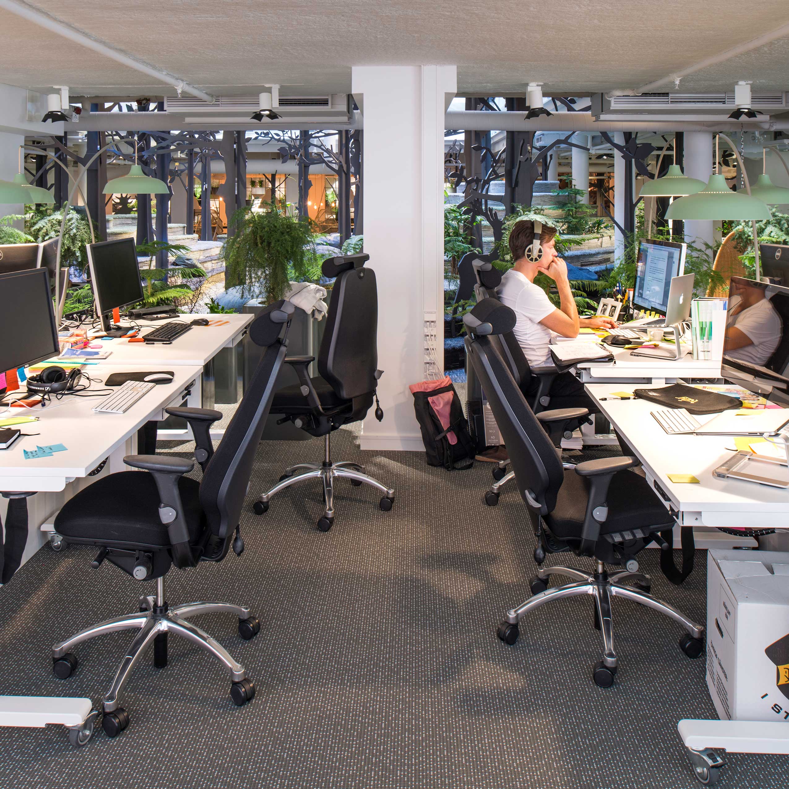 second angle of office space in Kings new office, featuring RH Logic chairs, with people working
