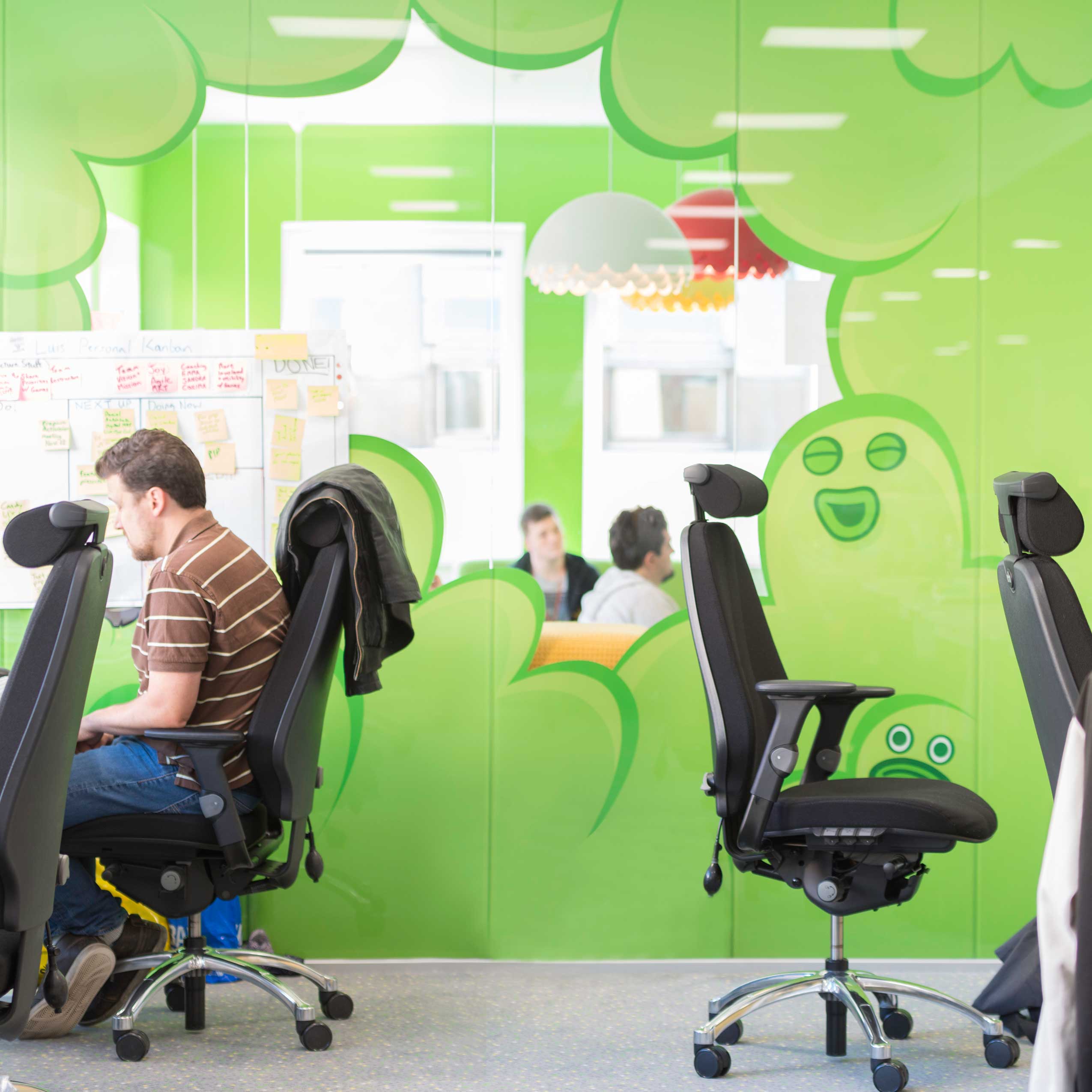 colourful playful wall in King's new office with RH Logic chairs 