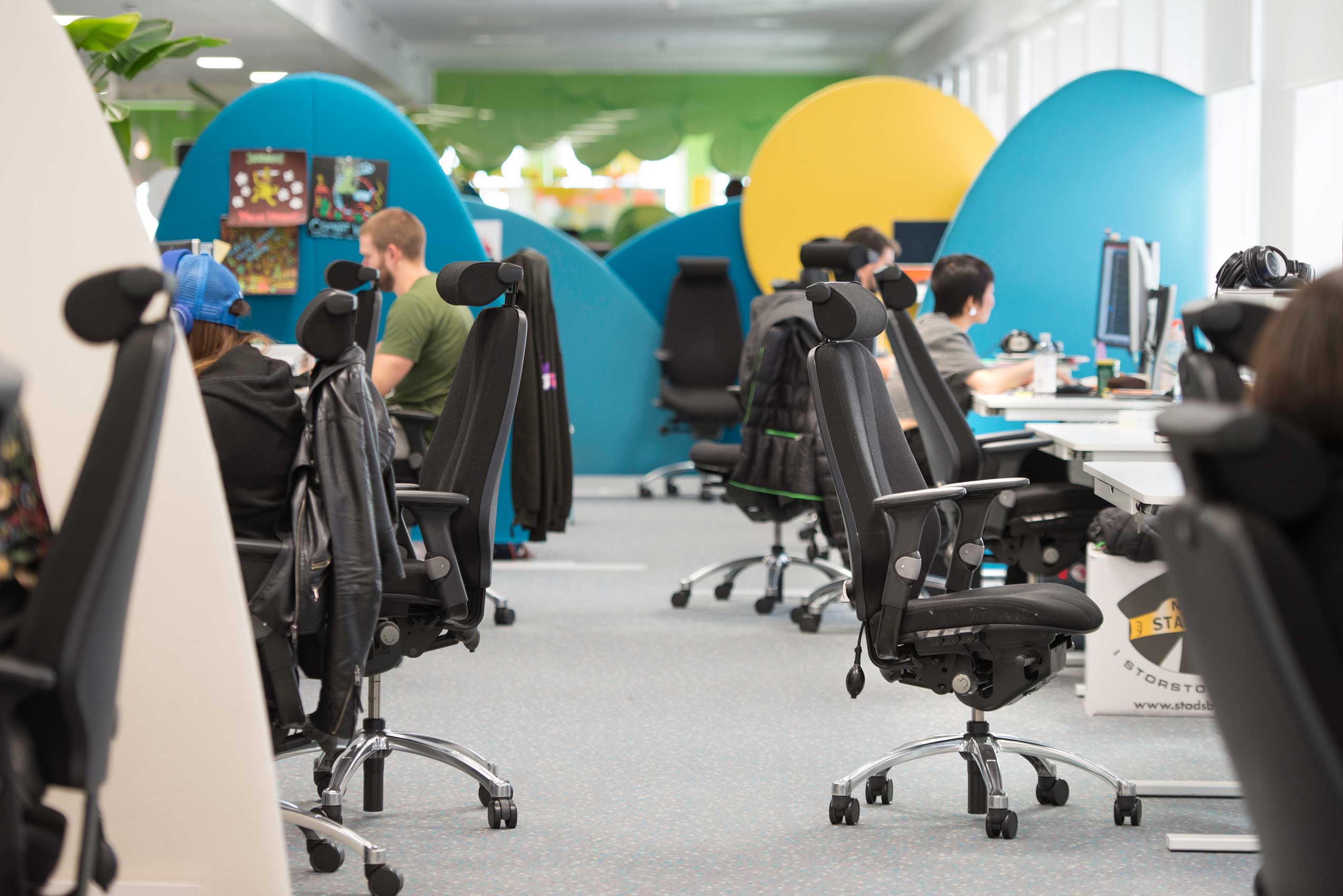 Angle 4 of office space in Kings new office, featuring RH Logic chairs, with people working