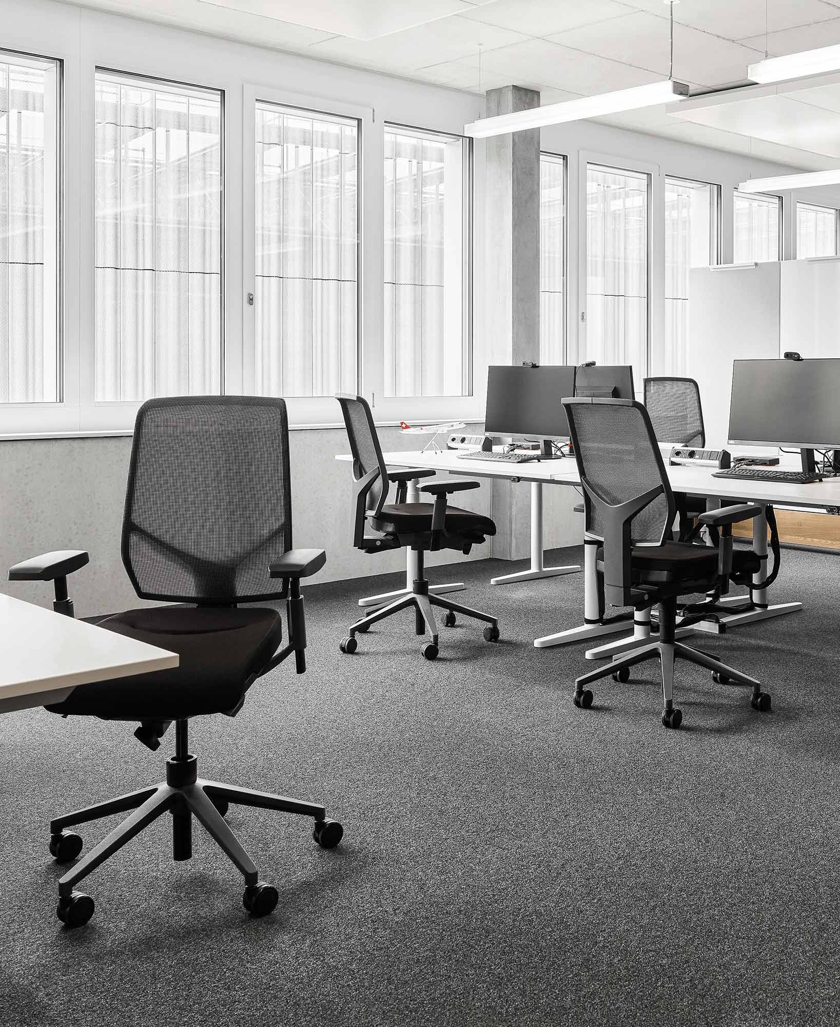 Angle 4 of Lufthana's new office, featuring Giroflex 68 chairs in black at workstations