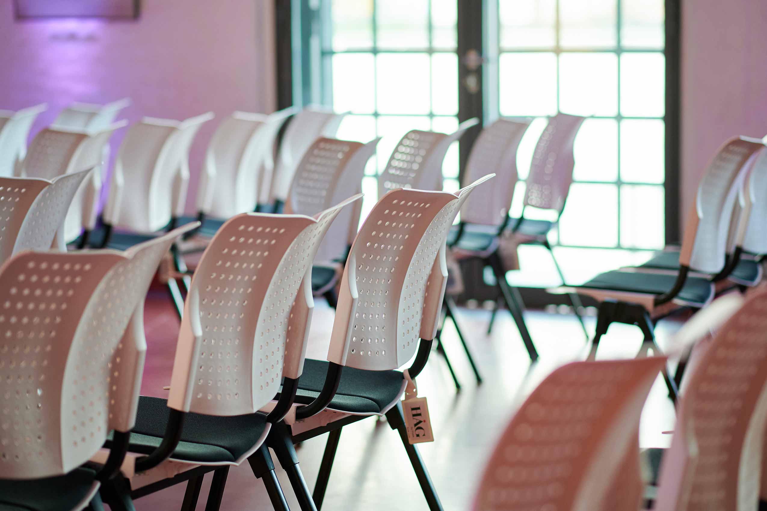 Close up of HÅG Conventio Wing chairs in event space at the Olympic Museum, Cologne | Photo : Dieter Jacobi