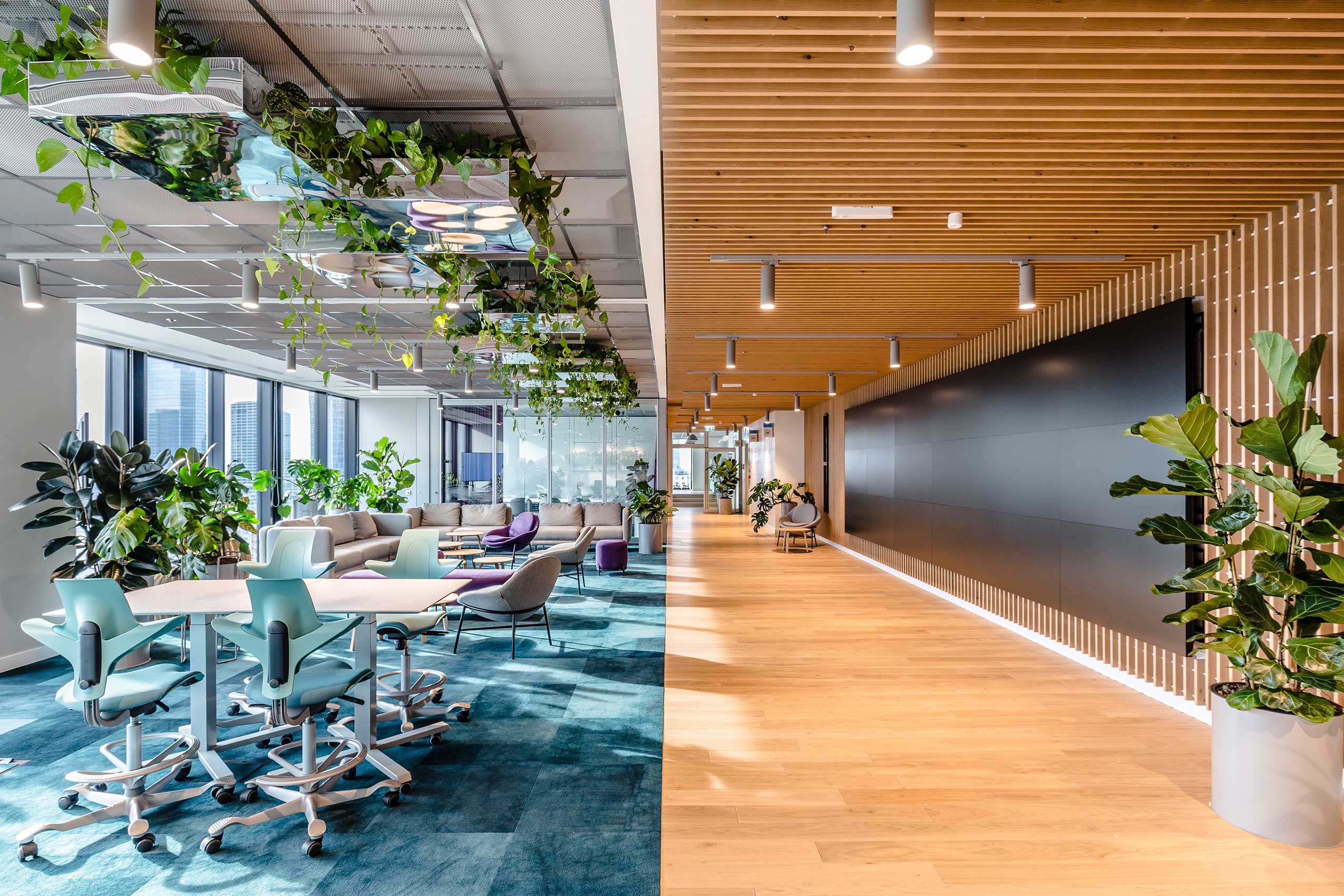 Blue HÅG Capisco Puls chairs in collaborative space at Orsted offices | Photo: Adam Grzesik