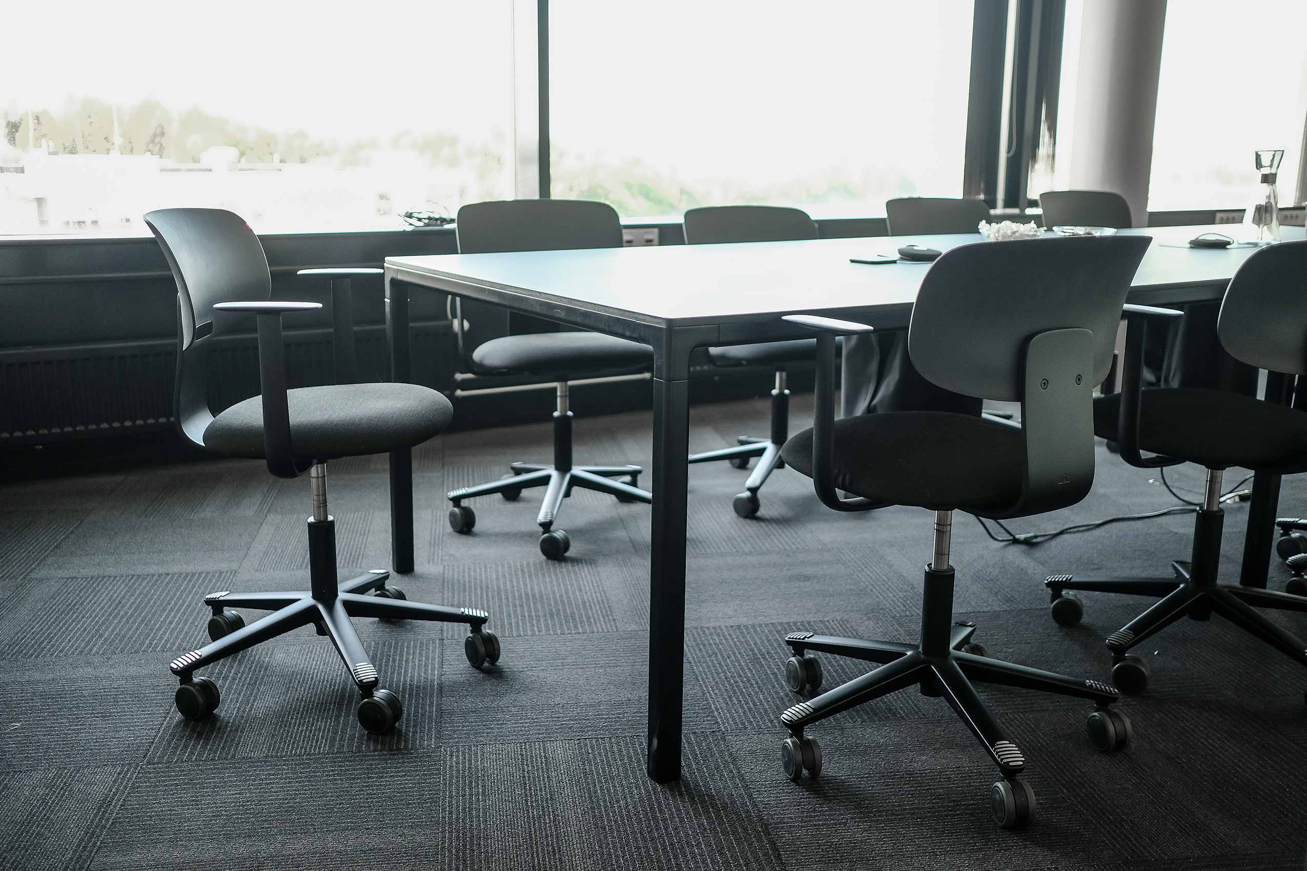 Close up on HÅG Tion chairs around a meeting table at Strex's Oslo office