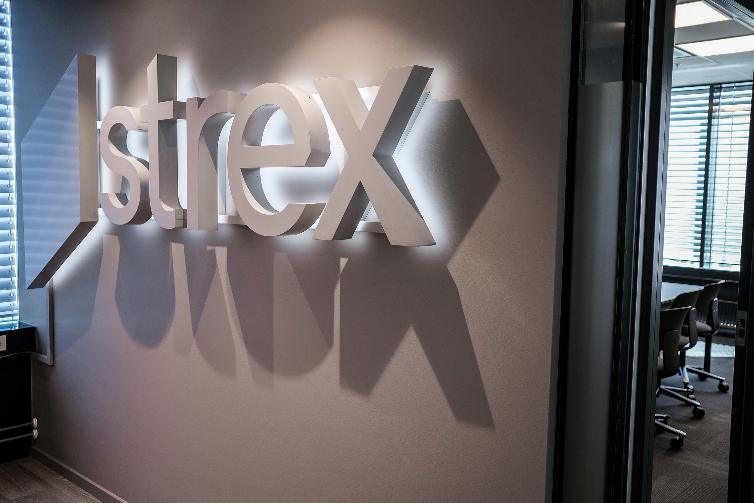 Close up of Strex logo on the wall at their office