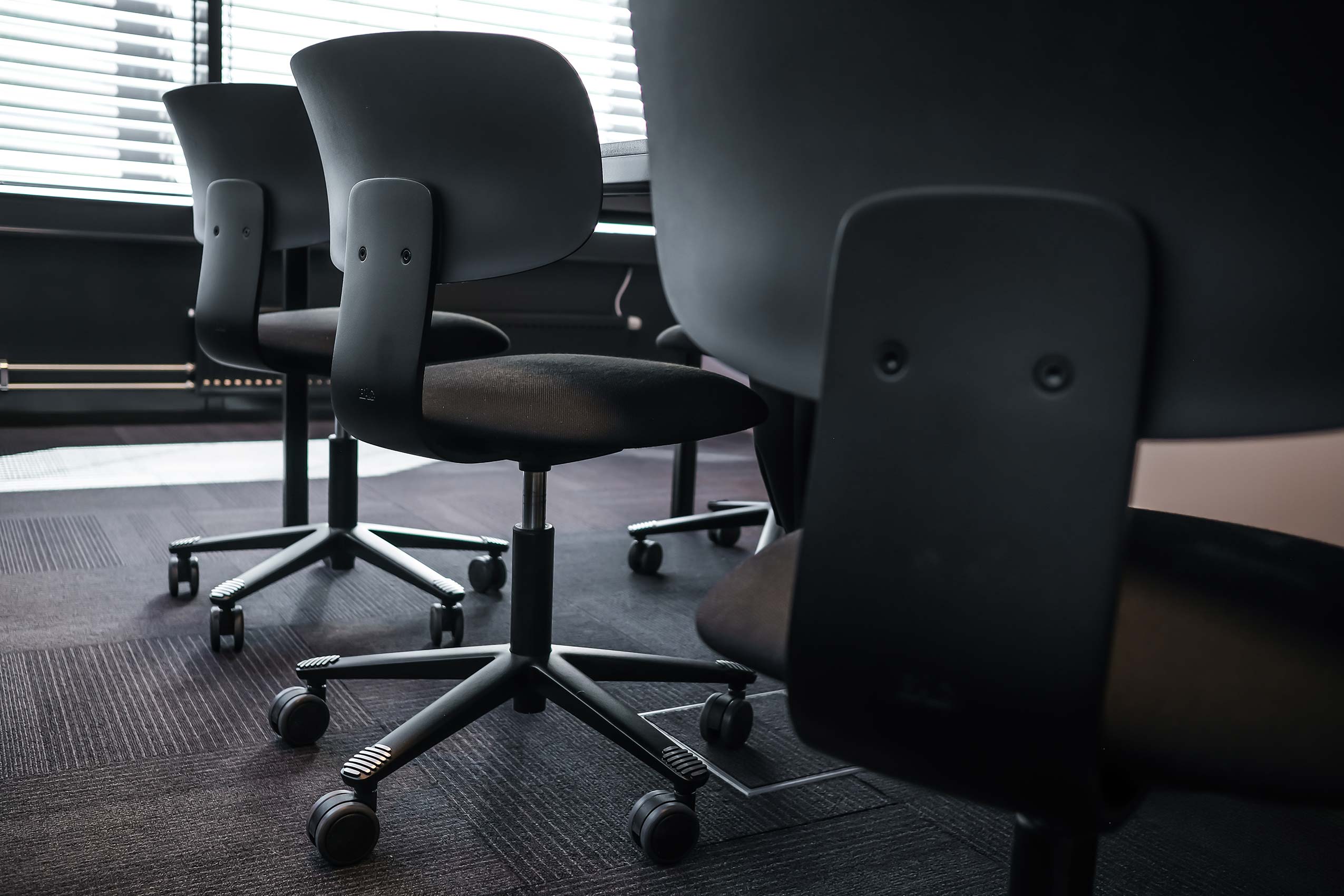 Close up of the back of HÅG Tion chairs in black
