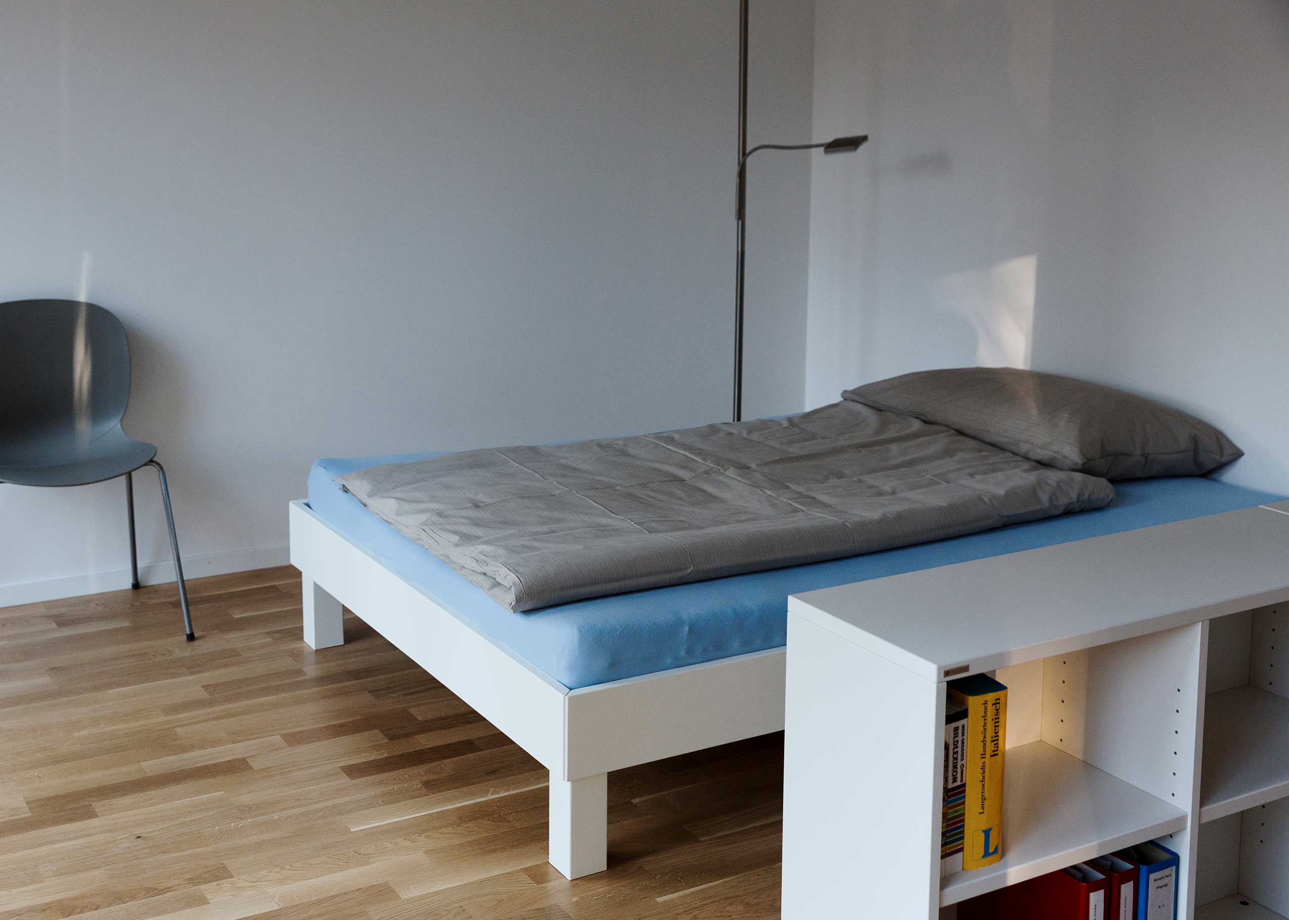 Profim Noor in bedroom at Student Lodge accommodation | Photo : Daniel Sutter
