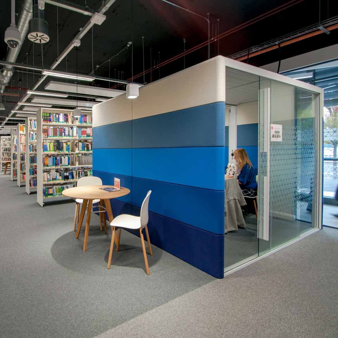 Private booth in a university library with RBM Noor chairs by Flokk in white